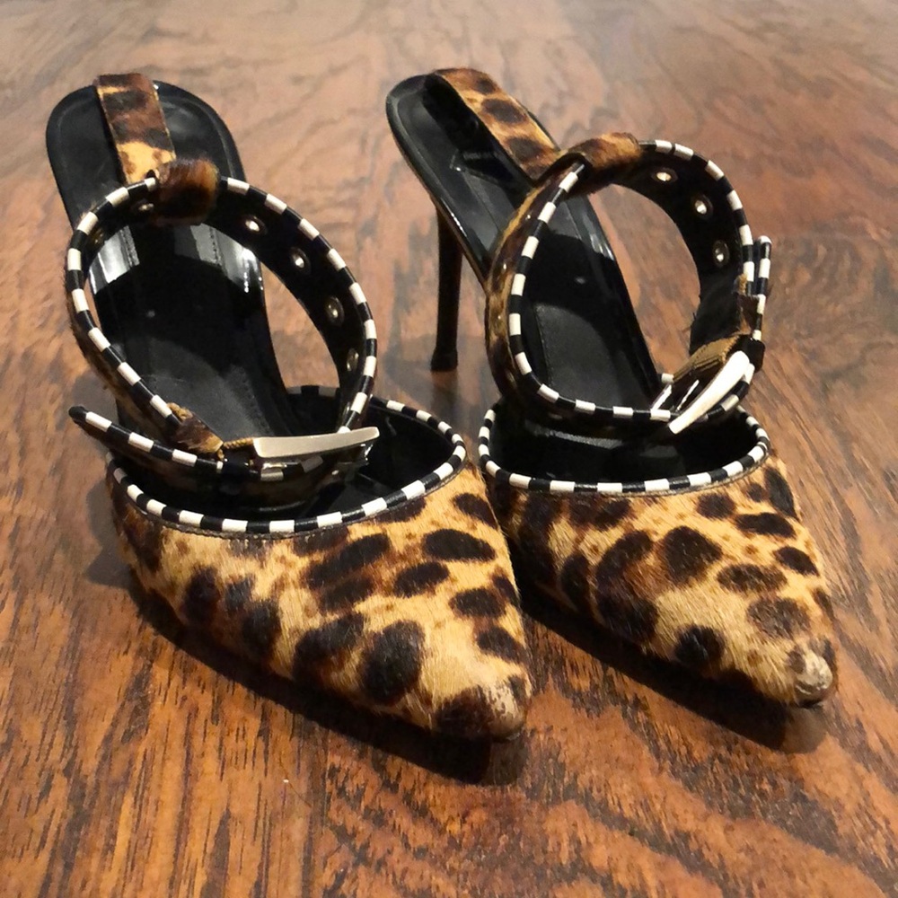 Leopard with black white trim silver buckle strap. Tip and heel just replaced.